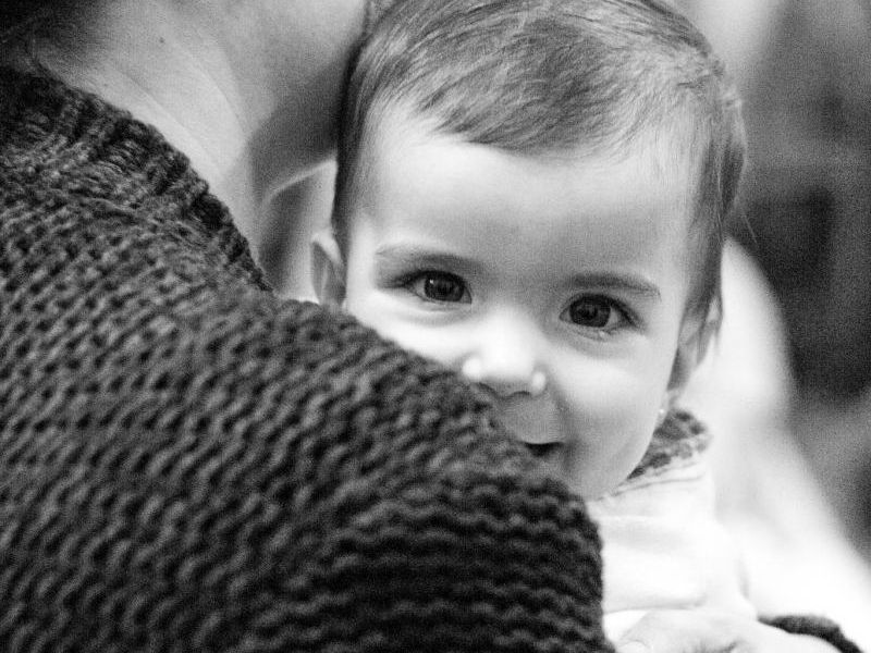 Child in Arms Looking at Camera BW